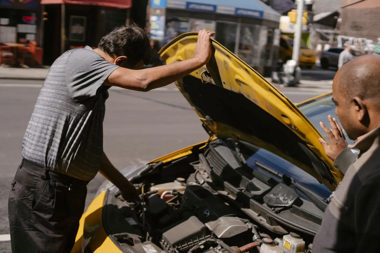 Mechanic working on an engine at a customer location