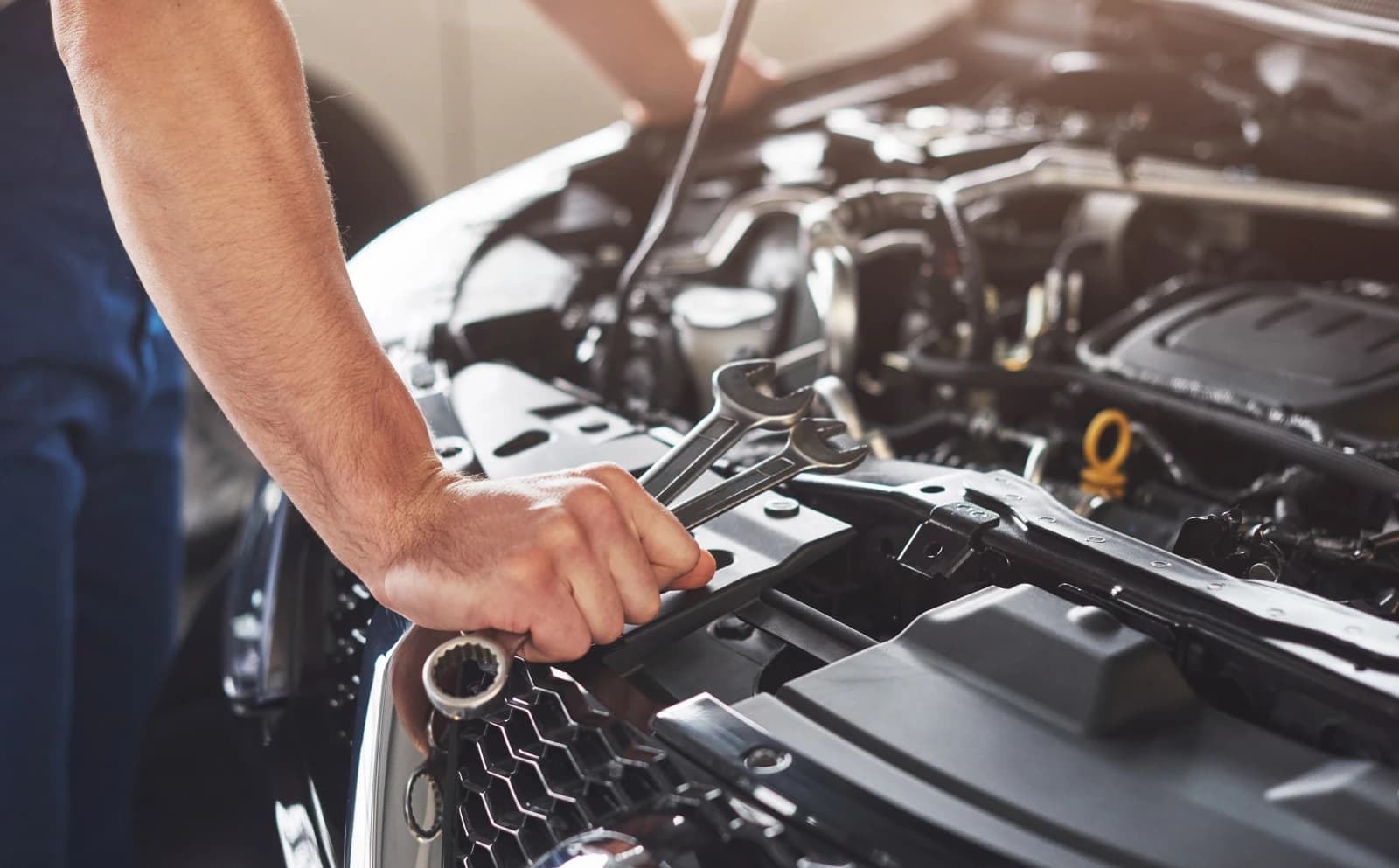 Mobile mechanic working on a customer vehicle