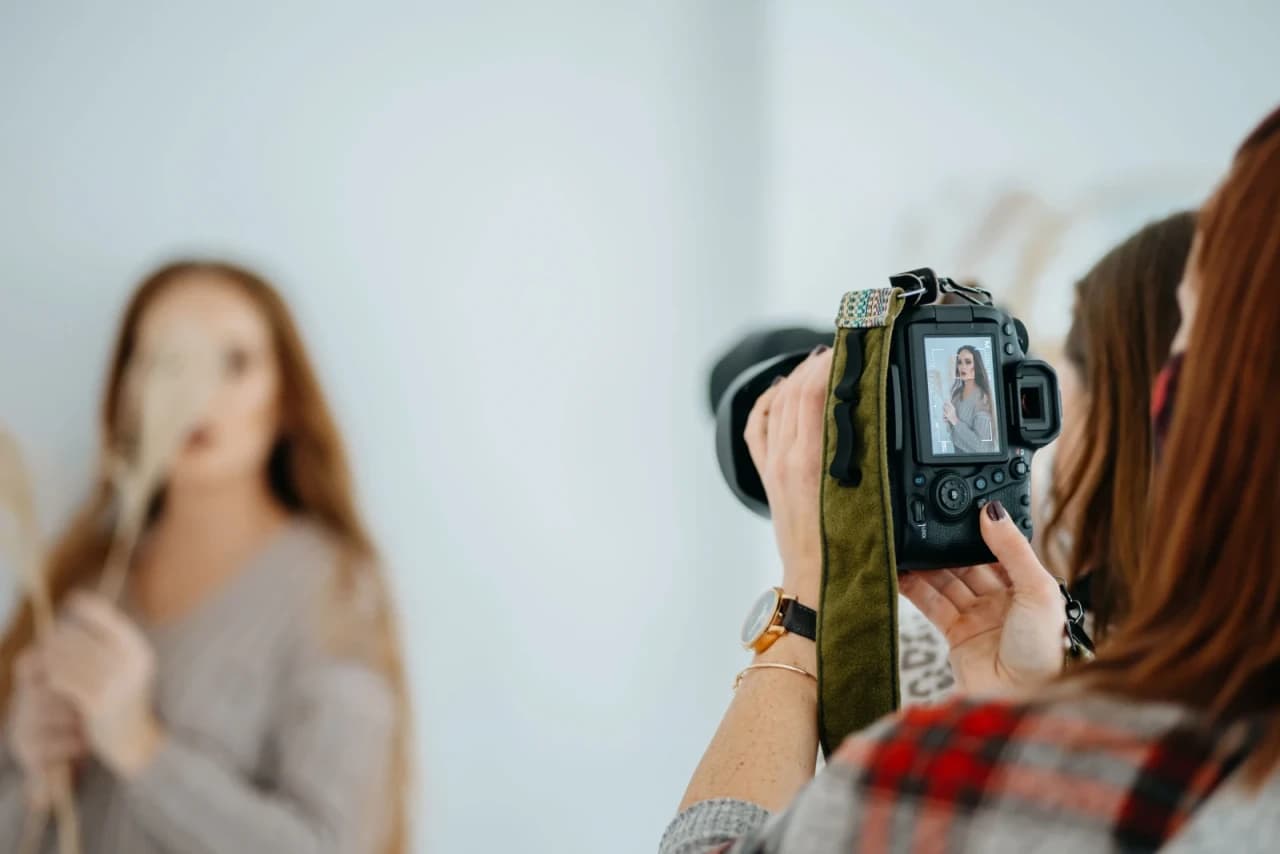 Photographer holding a professional camera
