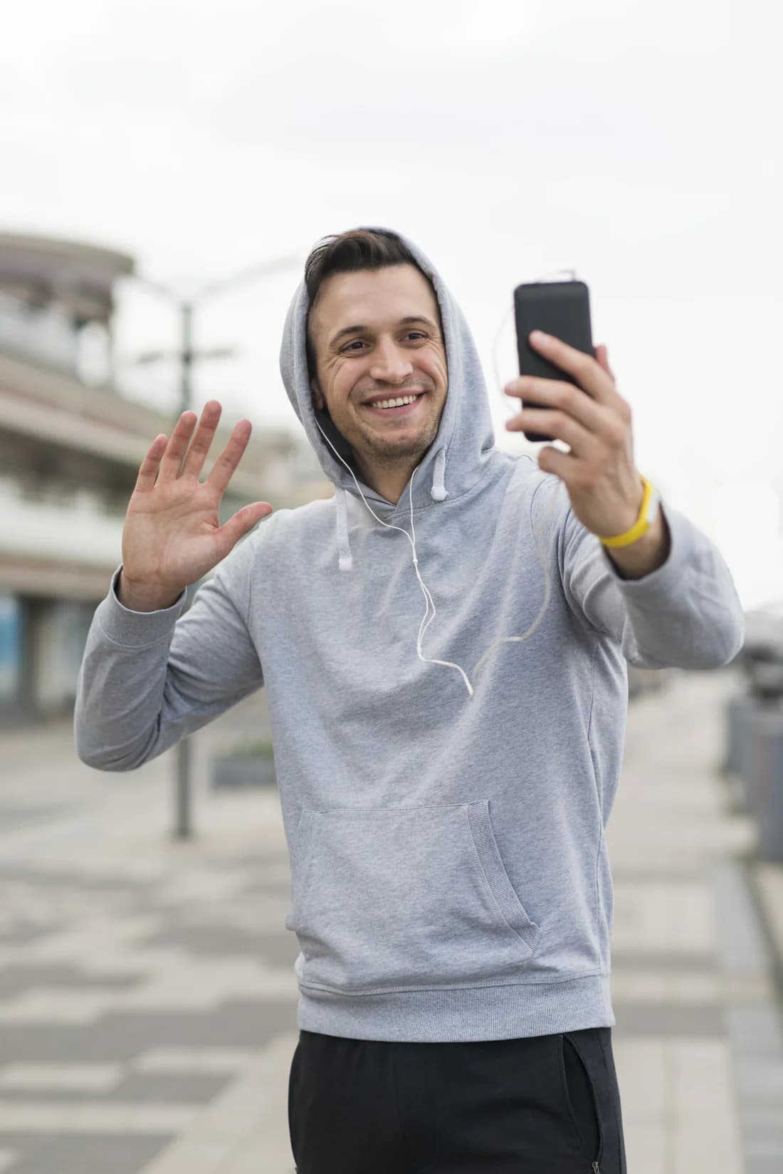 Trainer filming a story on his phone to share his booking link